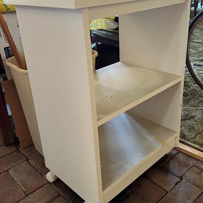 White bookshelf on wheels