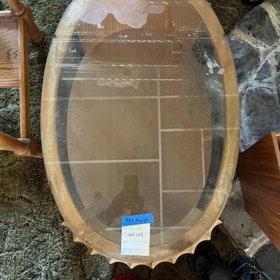 Oval wooden, glass top coffee table