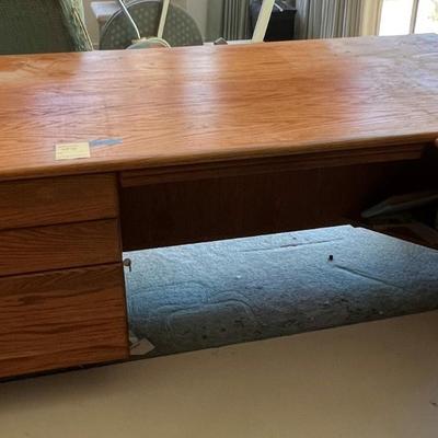 Oak wood desk with three drawers and keyboard tray