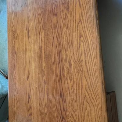 Oak wood desk with three drawers and keyboard tray