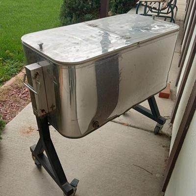 METAL COOLER ON CASTERS WITH A BOTTLE OPENER ATTACHED