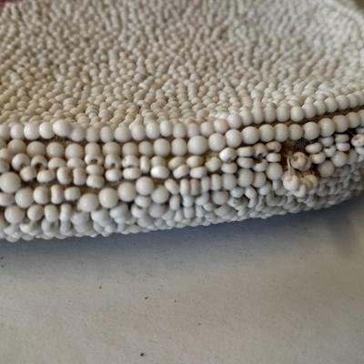 Japanese beaded purses with makeup compacts and pink depression glass heart dish
