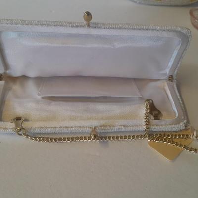 Japanese beaded purses with makeup compacts and pink depression glass heart dish