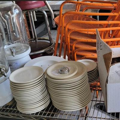 Stacks of plates, beverage dispensers, martini glasses