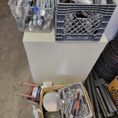 File Cabinet, crab pliers, tongs, pizza pans, coffee pots