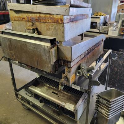 Stainless Steel cart with pizza pans.
