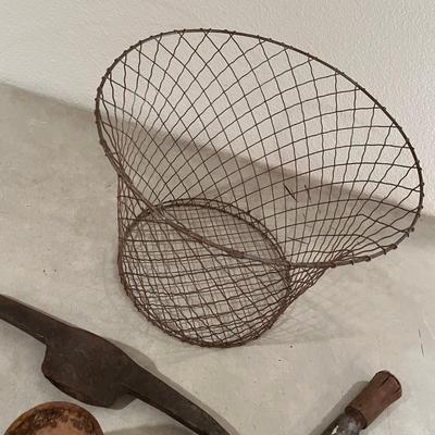 Wire basket with antique tools
