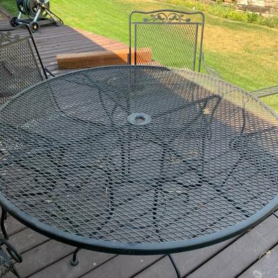 Iron Patio Table and 6 rocking chairs