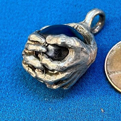 COOL HANDS GRABBING METALLIC BALL PENDANT SCULPTED LOOK