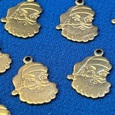 SET OF 24 SMALL INCISED SANTA CHARMS