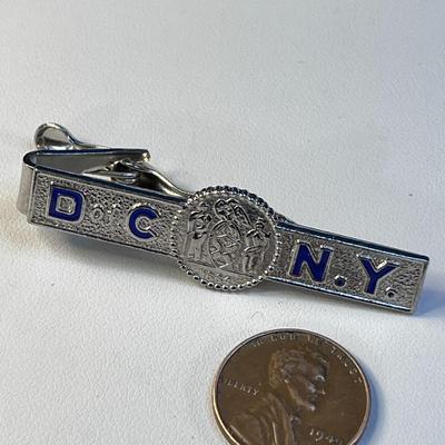 ENAMELED â€œD of C NYâ€ DEPARTMENT OF CORRECTIONS TIE CLASP