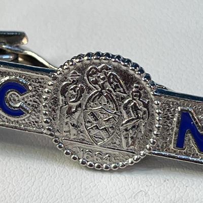 ENAMELED â€œD of C NYâ€ DEPARTMENT OF CORRECTIONS TIE CLASP