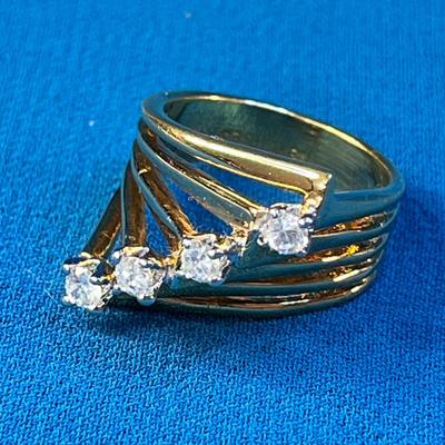 STRIKING MULTI-BAND 18K H.G.E. RING WITH 4 C.Z.â€™s?