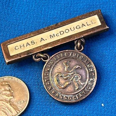 ANTIQUE COPPER â€œNATIONAL ELECTRIC LIGHT ASSOCIATIONâ€ BADGE PIN