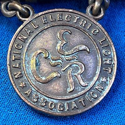 ANTIQUE COPPER â€œNATIONAL ELECTRIC LIGHT ASSOCIATIONâ€ BADGE PIN