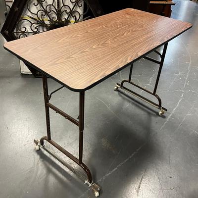  4 Foot Folding Table with Wheels attached
