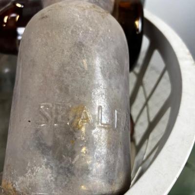 Basket full of Glass Antique Jars and Bottles 