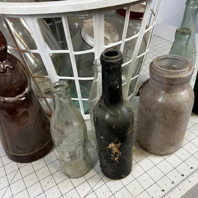 Basket full of Glass Antique Jars and Bottles 