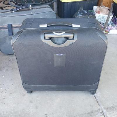 FOUR WHEELED HANDLED PORTIBLE CASE AND SUITCASE