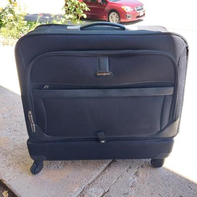 FOUR WHEELED HANDLED PORTIBLE CASE AND SUITCASE