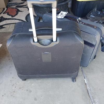 FOUR WHEELED HANDLED PORTIBLE CASE AND SUITCASE