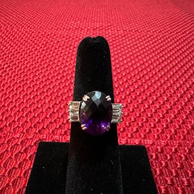 STUNNING STERLING SILVER RING WITH PURPLE STONE