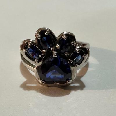 STERLING SILVER RING PAW SHAPED WITH BLUE STONES.