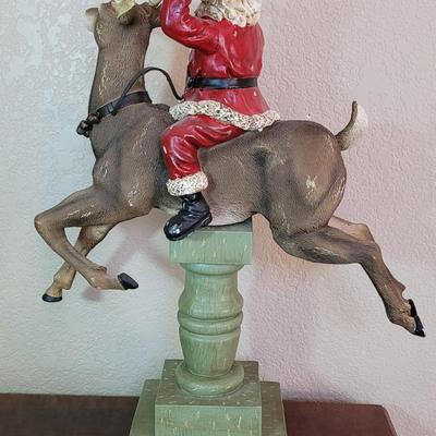 Large Santa Riding a Reindeer Statue