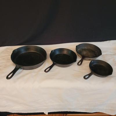 Four Cast Iron Pans (K-CE)