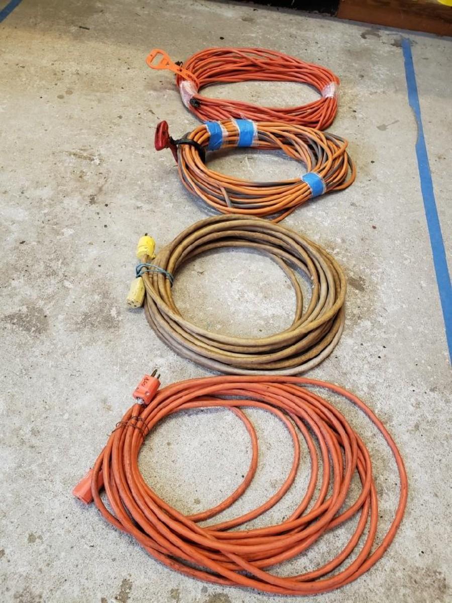 Collection of Extension Cords Various Lengths and Gauges