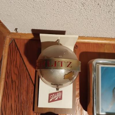 LIGHTED SCHLITZ BEER SIGN WITH A ROTATING GLOBE