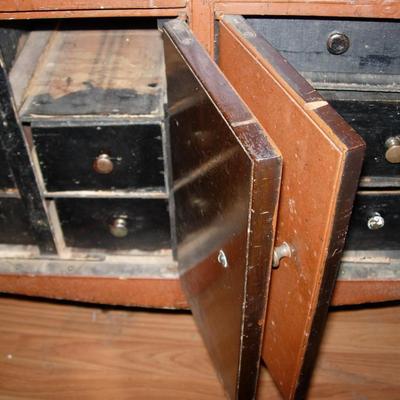 Antique Victrola Cabinet turned into storage unit.