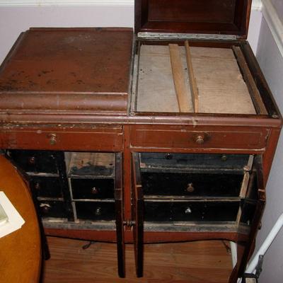 Antique Victrola Cabinet turned into storage unit.