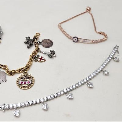 Lot #39  Jewelry Lot - Vintage Charm Bracelet and 2 other bracelets (1 Sterling)