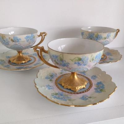 Four Sets of Vintage M.Z. Austrian Blue Floral Pattern Footed Teacups and Pedal Edge Saucers with Gilded Accent