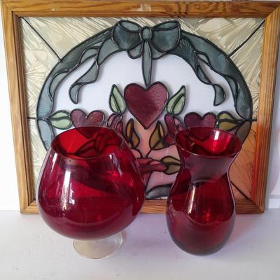 Framed window suncatcher and two red glass vases