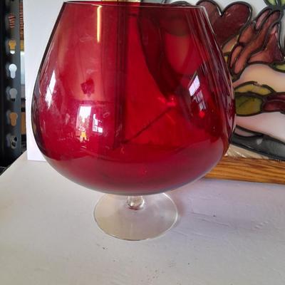 Framed window suncatcher and two red glass vases