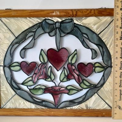 Framed window suncatcher and two red glass vases