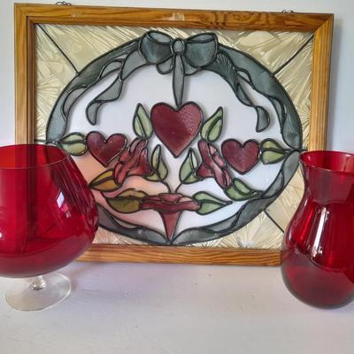 Framed window suncatcher and two red glass vases