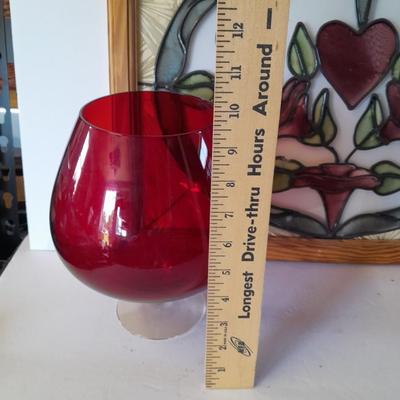 Framed window suncatcher and two red glass vases