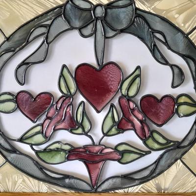 Framed window suncatcher and two red glass vases
