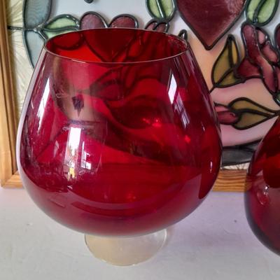 Framed window suncatcher and two red glass vases