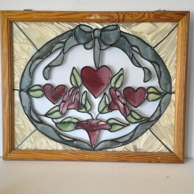 Framed window suncatcher and two red glass vases