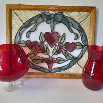 Framed window suncatcher and two red glass vases