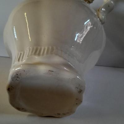 Pitcher with bowl and collectible pig figures