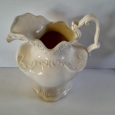 Pitcher with bowl and collectible pig figures