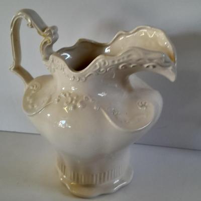 Pitcher with bowl and collectible pig figures