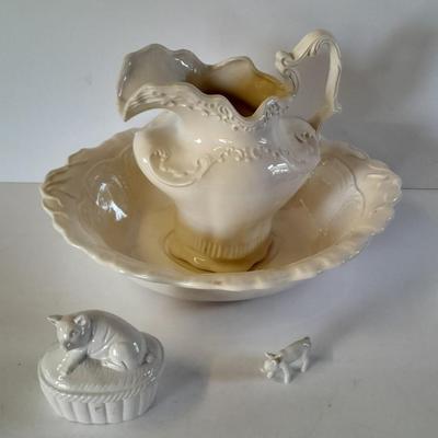 Pitcher with bowl and collectible pig figures