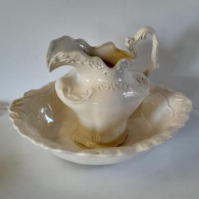 Pitcher with bowl and collectible pig figures