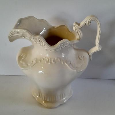 Pitcher with bowl and collectible pig figures